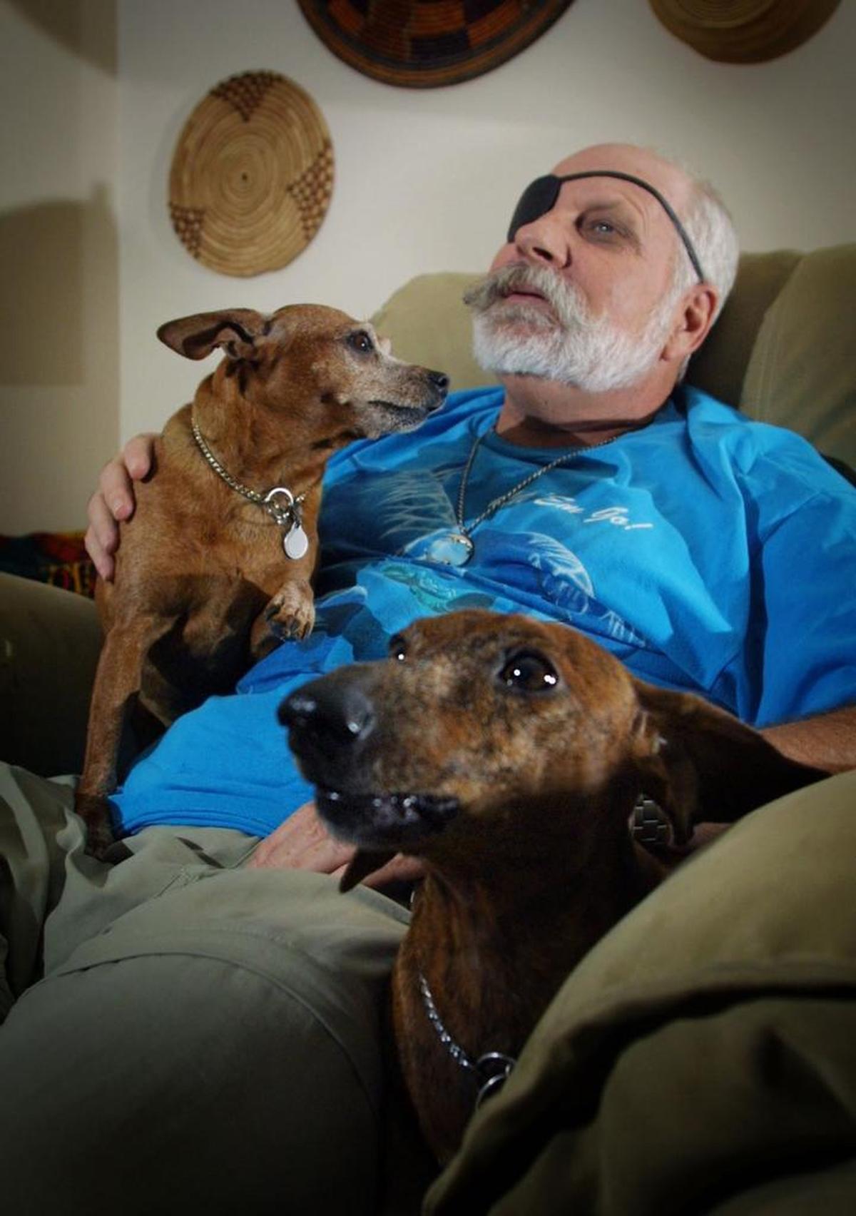 Activist Russ Rector pictured in 2003 with his two dogs, Kisses and Beethoven.