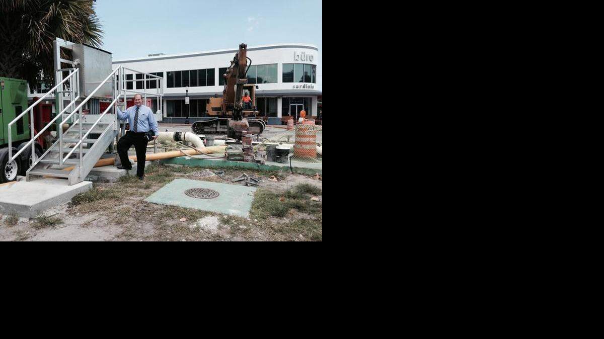 
Miami Beach Public Works director Eric Carpenter stands next to a project along Purdy Avenue, where workers are installing a piece of the city's expansive pump system.

