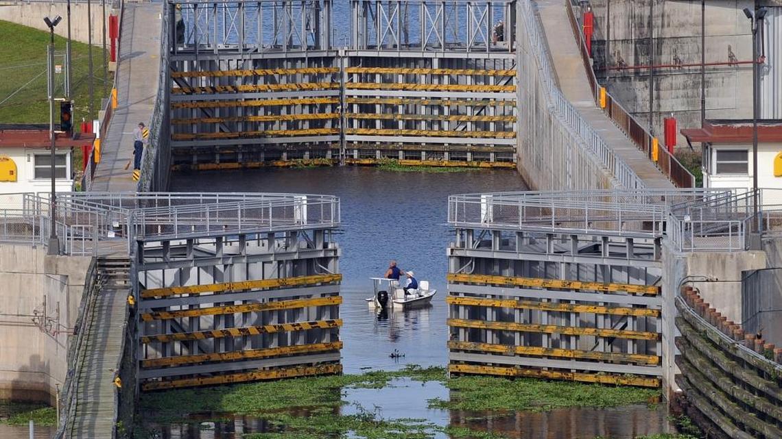 A small boat moves through the lock at Port Mayaca when lake levels were high in 2008.