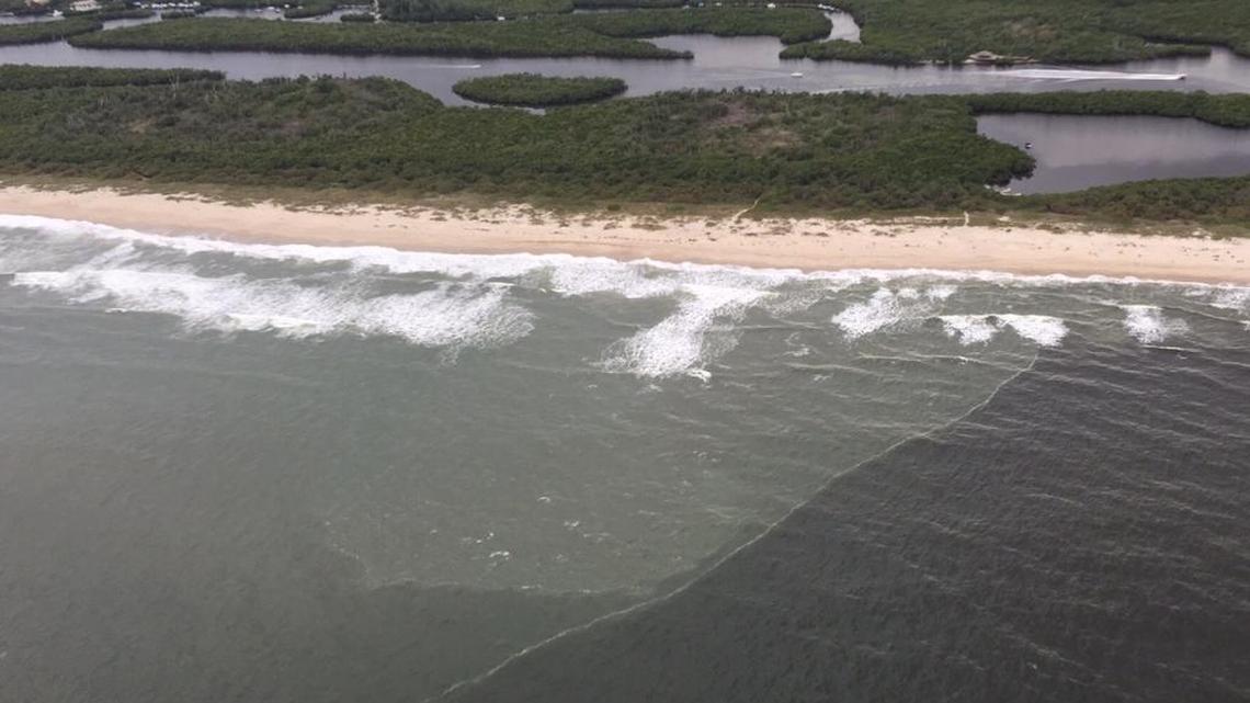 A line of black water flowed from the St. Lucie inlet Feb. 22. Scientists say the water is a brew of sediment and freshwater carried from Lake Okeechobee and local watersheds.