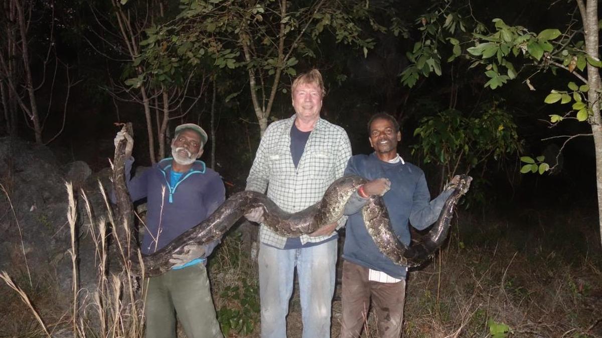 Irula snake hunters Vadivel Gopal, left, and Masi Sadaiyan with herpetologist Joe Wasilewski. Over the last two months the hunters, who hunt cobras in India, have worked with the state to look for pythons.