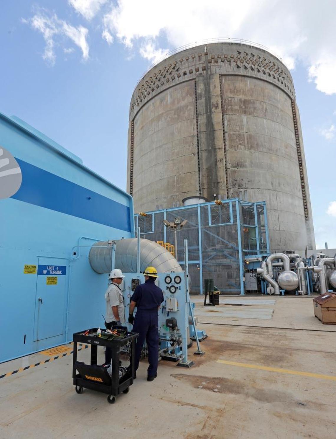 Pehter Rodriguez and Juan Madruga, both instrument and control specialists, work on the nuclear reactor unit 4 turbine on Thursday, May 18, 2017 at Turkey Point.