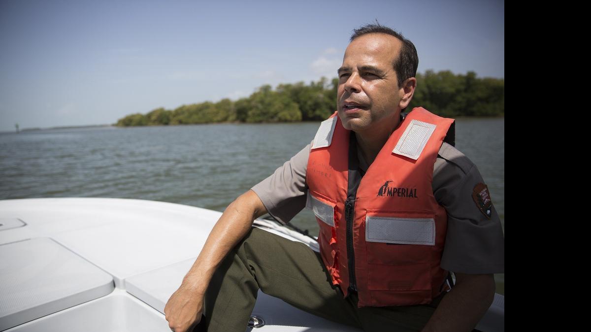 
Everglades National Park Superintendent Pedro Ramos looks out at the Florida Bay during a boat ride through the Everglades on Thursday. Ramos has grand plans for the Flamingo Lodge, which was demolished in 2009 after suffering heavy hurricane damage in 2005, and hopes to replace it with elevated cottages, eco-tents and solar-powered hot showers.
