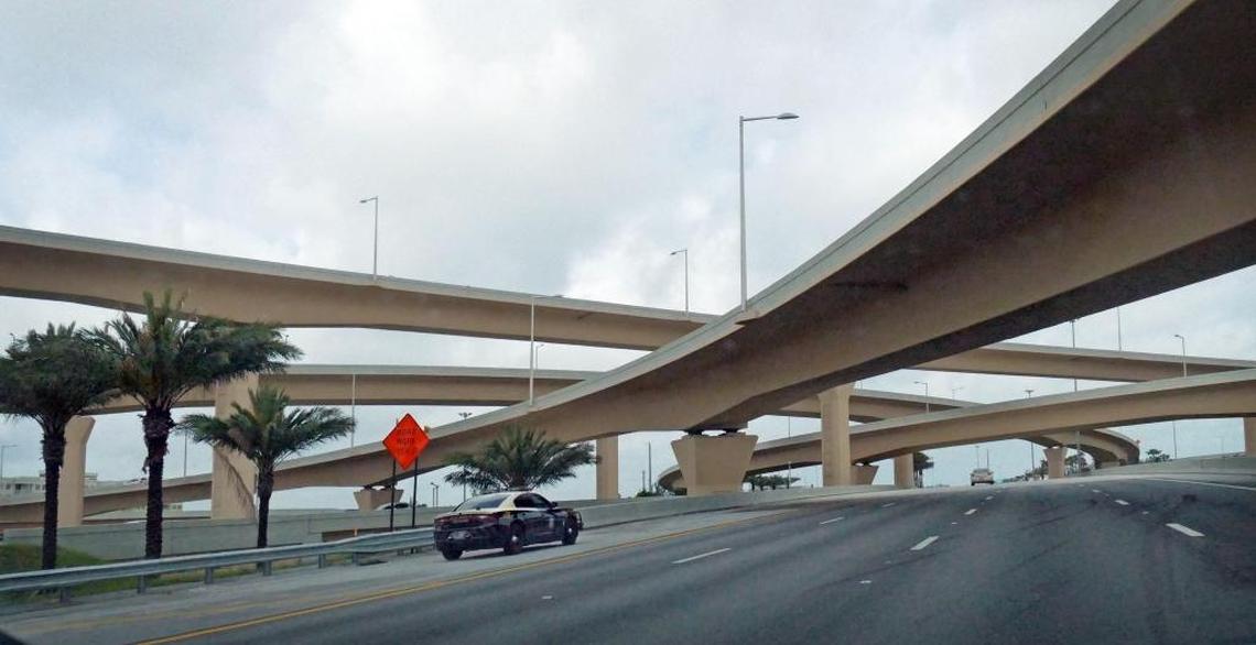 An FHP vehicle sits on the side of the road on the Statge Road 836 westbound lanes on Thursday. Low Florida Highway Patrol salaries have caused a shortage of troopers, high turnover rate and consequently a plunge in the number of speeding tickets and other citations issued by troopers.