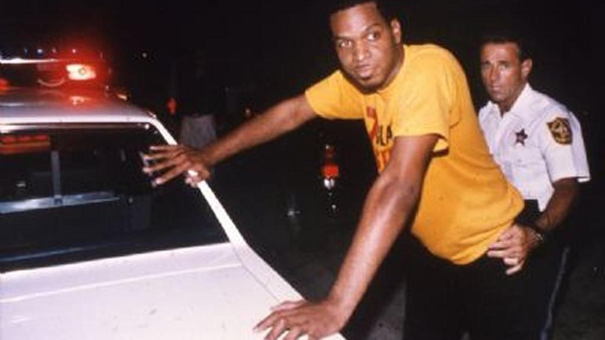 Luther Campbell, leader of the Band 2 Live Crew, is arrested by a Broward sheriff's policeman early Sunday before he was charged with violating obscenity laws during a performance at a club in Hollywood.