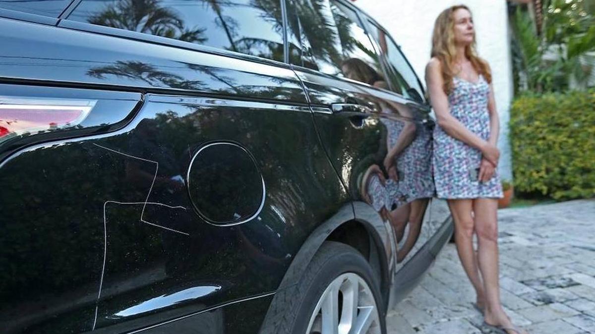 Kim Rosenfeld stands near her car that was vandalized with a swastika on Prairie Avenue in Miami Beach in February 2017.