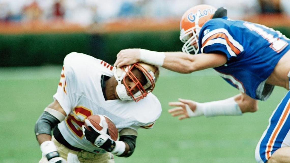 UF’s Monty Grow, right, on the field in 1993.