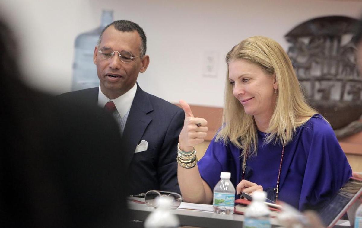 Michele King Soffer, right, gives the thumbs-up during a workshop at the Little Haiti Cultural Center with members of the Haitian community. On her left is Ghislain Gouraige Jr., chairman of The Ayiti Community Trust, which is seeking to raise $20 million to distribute grants to benefit Haiti. The Trust is working with the Miami Foundation.