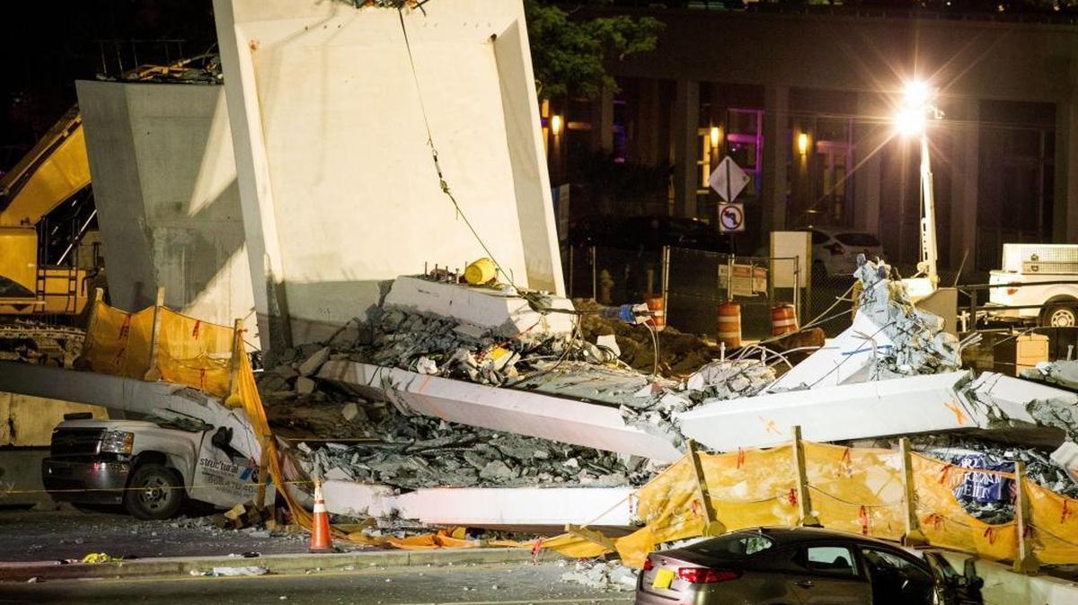 At least six people were killed Thursday when the FIU pedestrian bridge collapsed. At least five vehicles remained trapped under the debris, which authorities suspect may hold more victims.