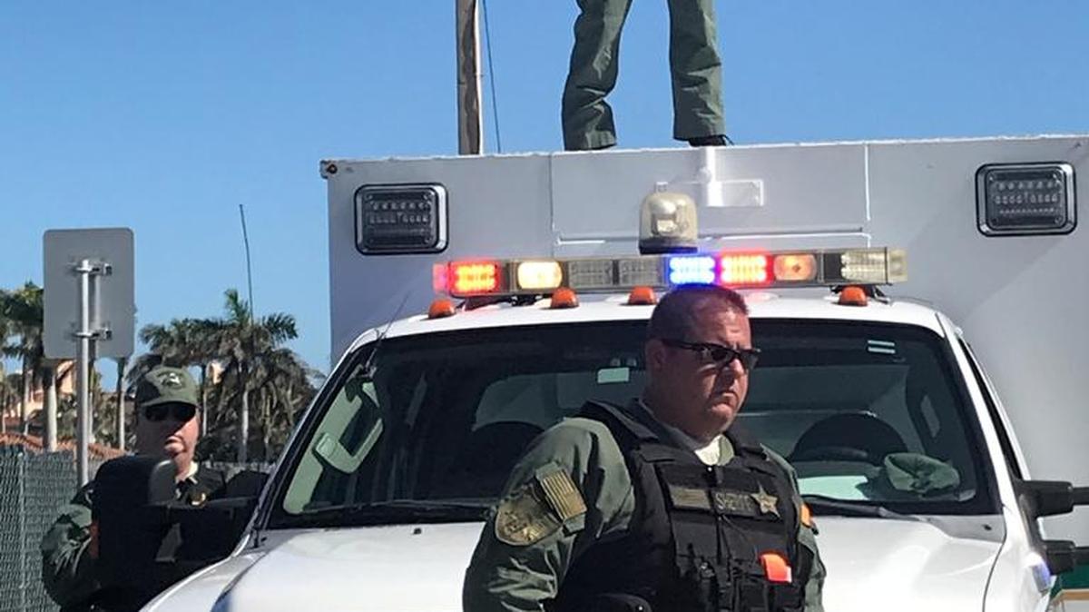 Law officers maintain order outside Mar-a-Lago, where protesters appeared in advance of President Trump’s Thanksgiving visit