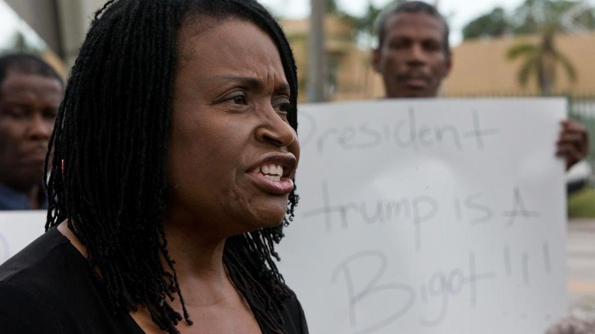 Marleine Bastien, executive director, Haitian Women of Miami (FANM) condemns President Trump's recent remarks denigrating Haiti, as she speaks during a news conference before a march commemorating the eighth anniversary of the Haitian earthquake, Friday, Jan. 12, 2018, in Miami.