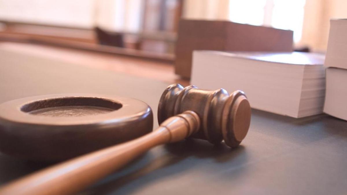 Former U.S. Citizenship and Immigration official Jovany Perez was sentenced to four years in federal prison after pleading guilty to receiving a bribe from a woman he tried to extort for sex.