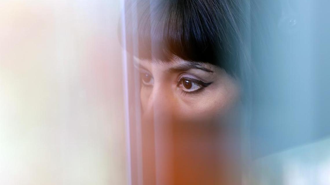 In this file photo, an advocate works in a cubicle at the National Domestic Violence Hotline center's new facility in Austin, Texas.