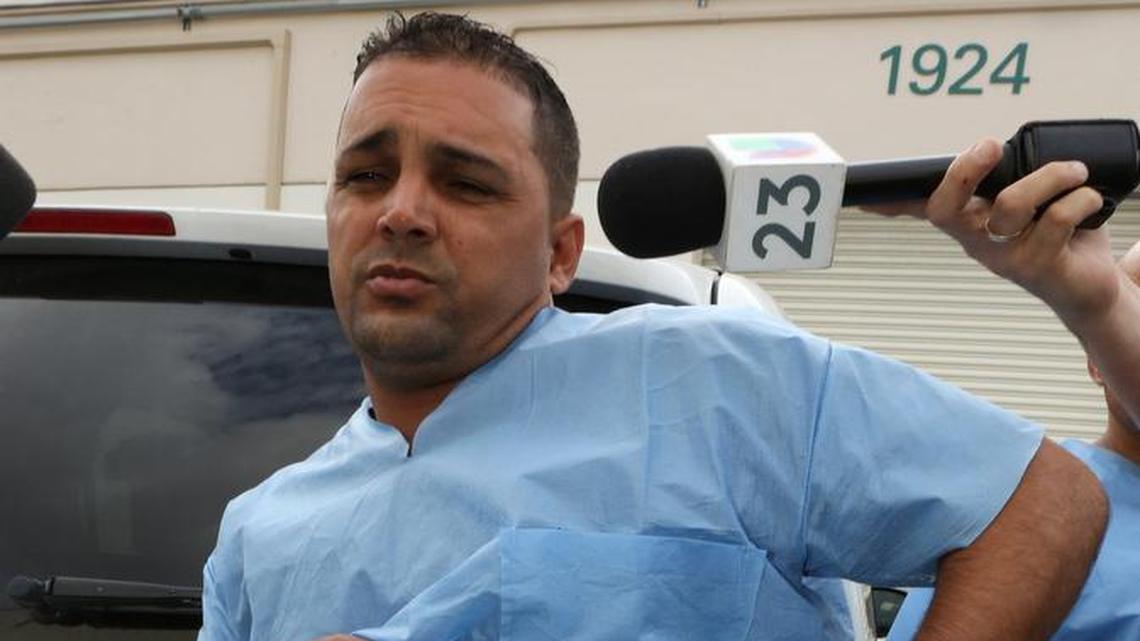 Yaser Cabrera Romero, one of the rafters who arrived from Cuba on Saturday, talks to the press on Sunday and shows the bullet wound he sustained during the crossing.