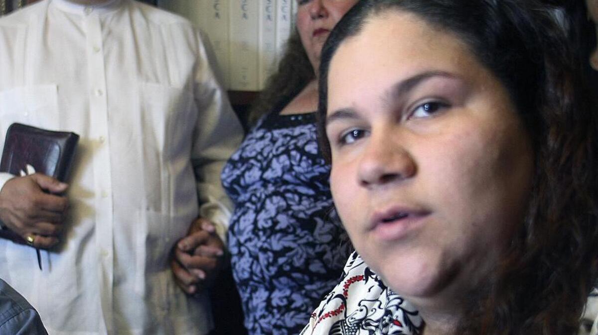 In this 2008 photo, Gabriela Pacheco appears with her parents, Enrique Pacheco and María de Fátima Pacheco, during a news conference in Miami.