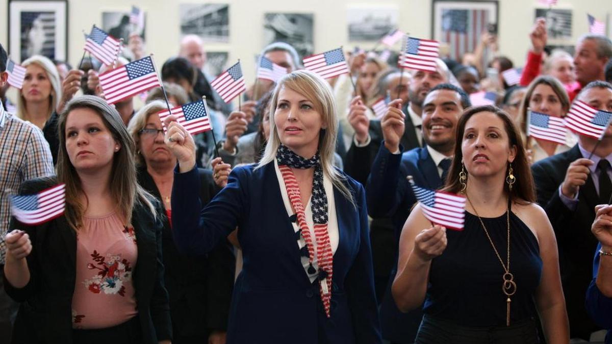 Yenisleidy Cabrera, of Cuba, Dirce R. Torres, of Brazil, and Paola Pineda, of Argentina, were among more than 160 people who became U.S. citizens during a swearing-in ceremony on Friday, May 26, 2017.