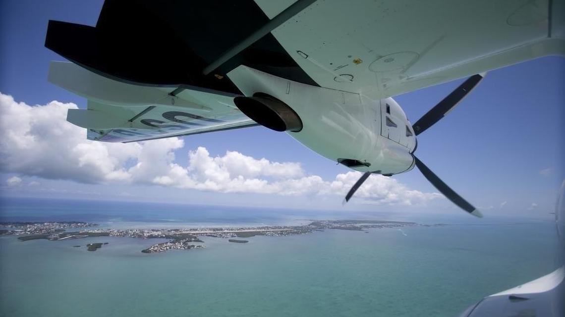 A U.S. Coast Guard HC-144A Ocean Sentry aircraft flies over the Florida Keys looking for Cuban migrants on the high seas.