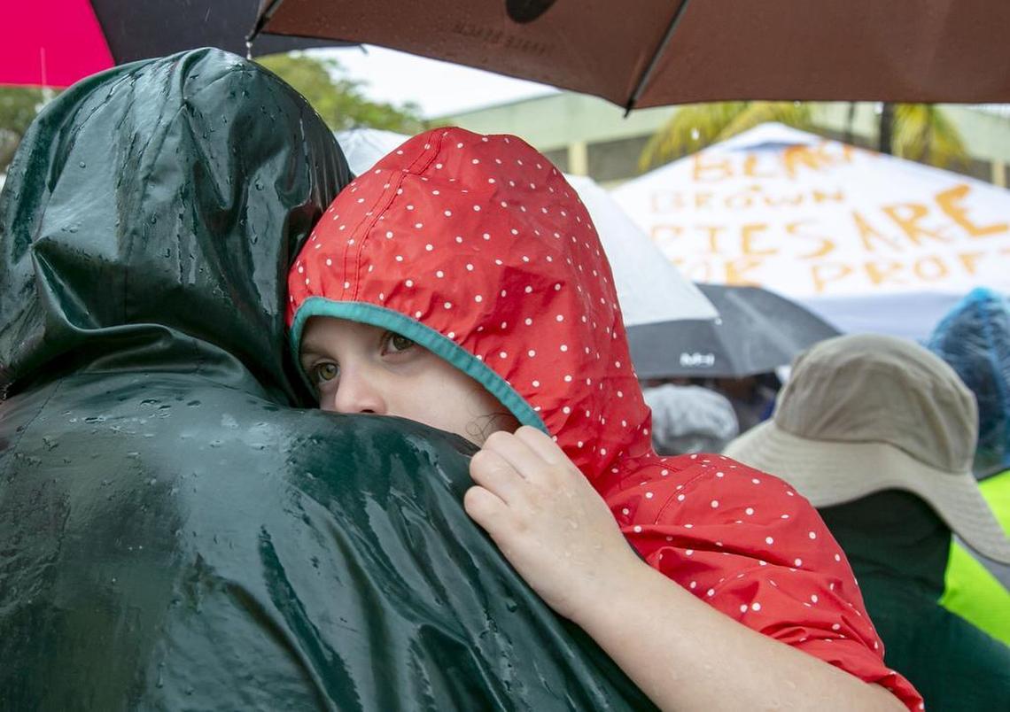 Eliana Young, 4, is held by her father Rabbi Daniel Young amongst over a hundred protestors, during a Father’s Day march at the Homestead Detention Center for children on Sunday, June 16, 2019.