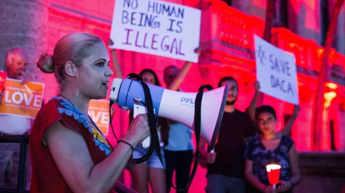 Karla De Anda speaks in defense of the program during the vigil for the DACA in front of the Freedom Tower on Friday, September 1, 2017.
