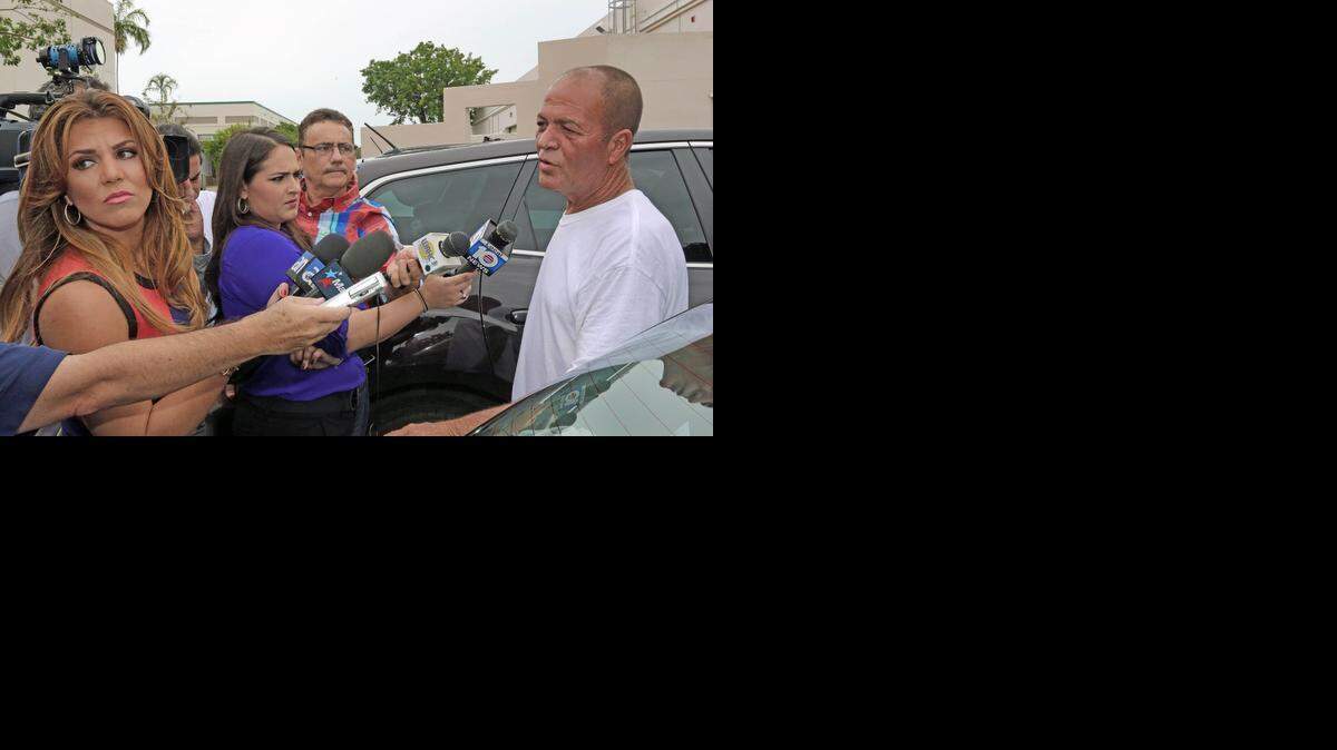 
Cuban rafter Rene Morales, 53, the captain of the makeshift boat that included eight other rafters who landed on the beach in Key Biscayne, behind Mar Azul Condominiums, answers media questions outside Church World Service in Doral on Wednesday, Sep. 24, 2014.

