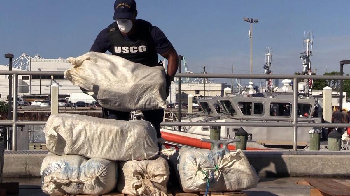 In this 2015 file photo, members of the U.S. Coast Guard unload drugs from Coast Guard vessels in Miami Beach.