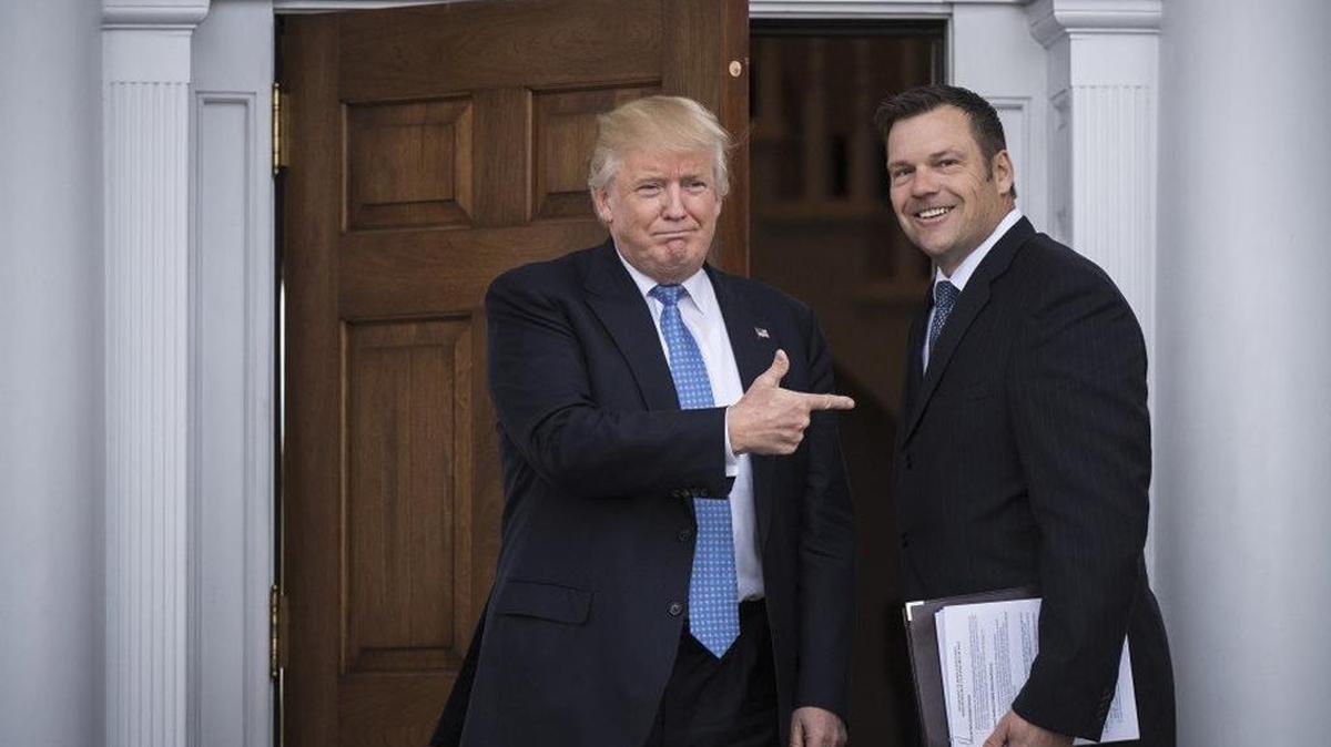 President-elect Donald Trump greets Kansas Secretary of State, Kris Kobach, at the clubhouse at Trump National Golf Club Bedminster in Bedminster Township, N.J.