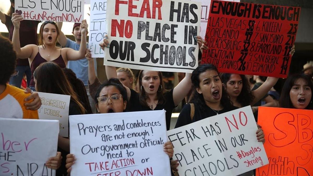 Protesters gathered Feb. 17 on the steps of the federal courthouse in Broward County to call for stronger gun control after student Nikolas Cruz opened fire with an AR-15 rifle at Marjory Stoneman Douglas High School in Parkland.