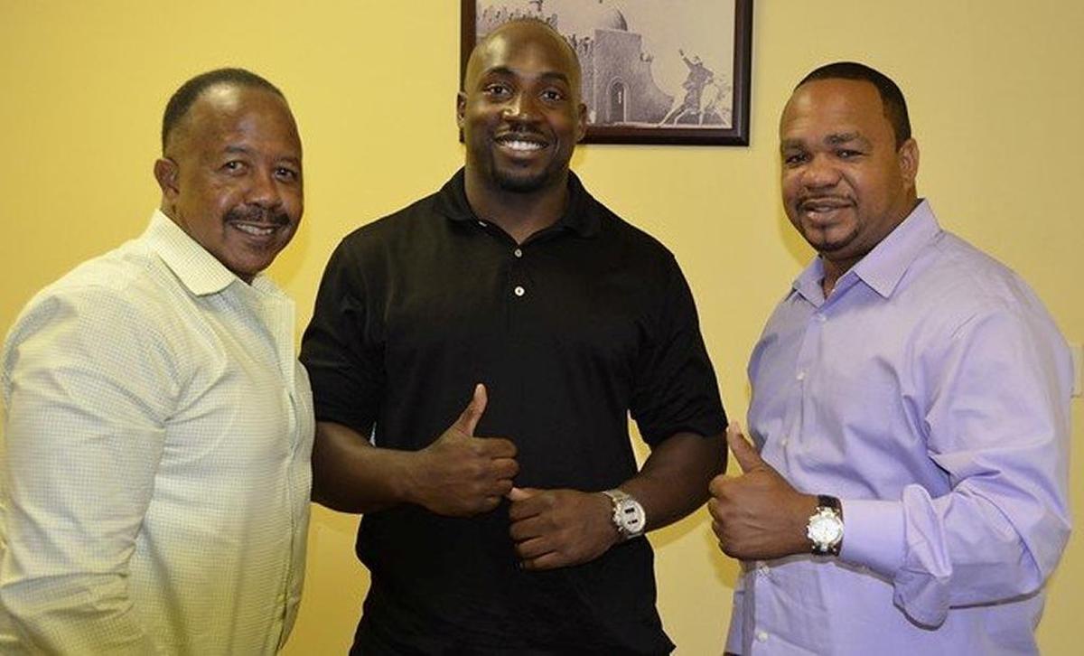 Opa-locka’s new city manager, Ed Brown, is pictured at far left, and the late Commissioner Terence Pinder is shown at far right.