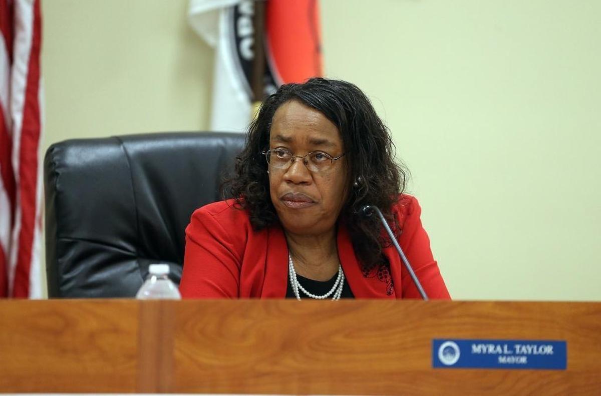 Opa-locka Mayor Myra Taylor sits on the dais at a city commission meeting on Wednesday, May 11, 2016, as the future of the embattled city is discussed.