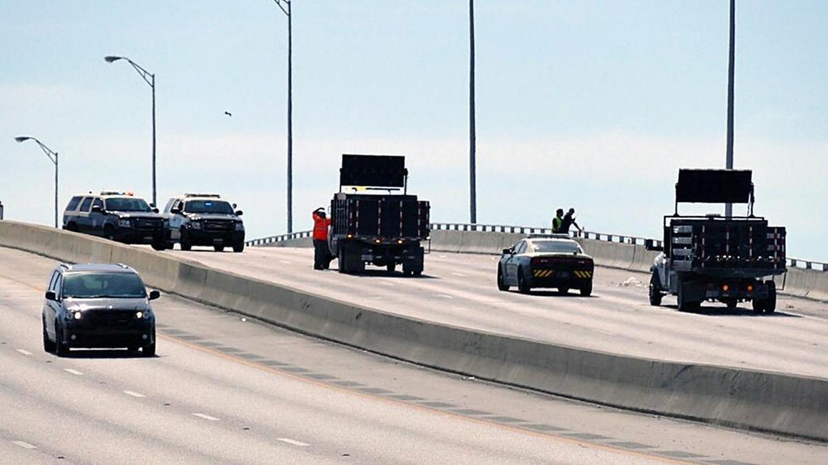 Florida Highway Patrol troopers block the eastbound lanes of the Julia Tuttle Causeway after an early-morning crash that killed three people on Tuesday, May 23, 2017. The crash caused one of the worst traffic jams in years in Miami-Dade County.