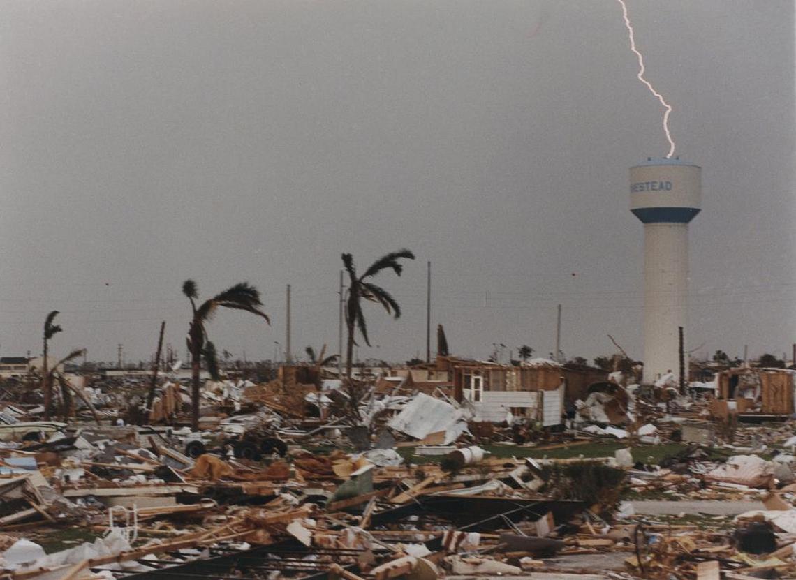 In this file photo, lightning strikes as thunderstorms sweep through the ruins of Homestead in the days after Hurricane Andrew in 1992.