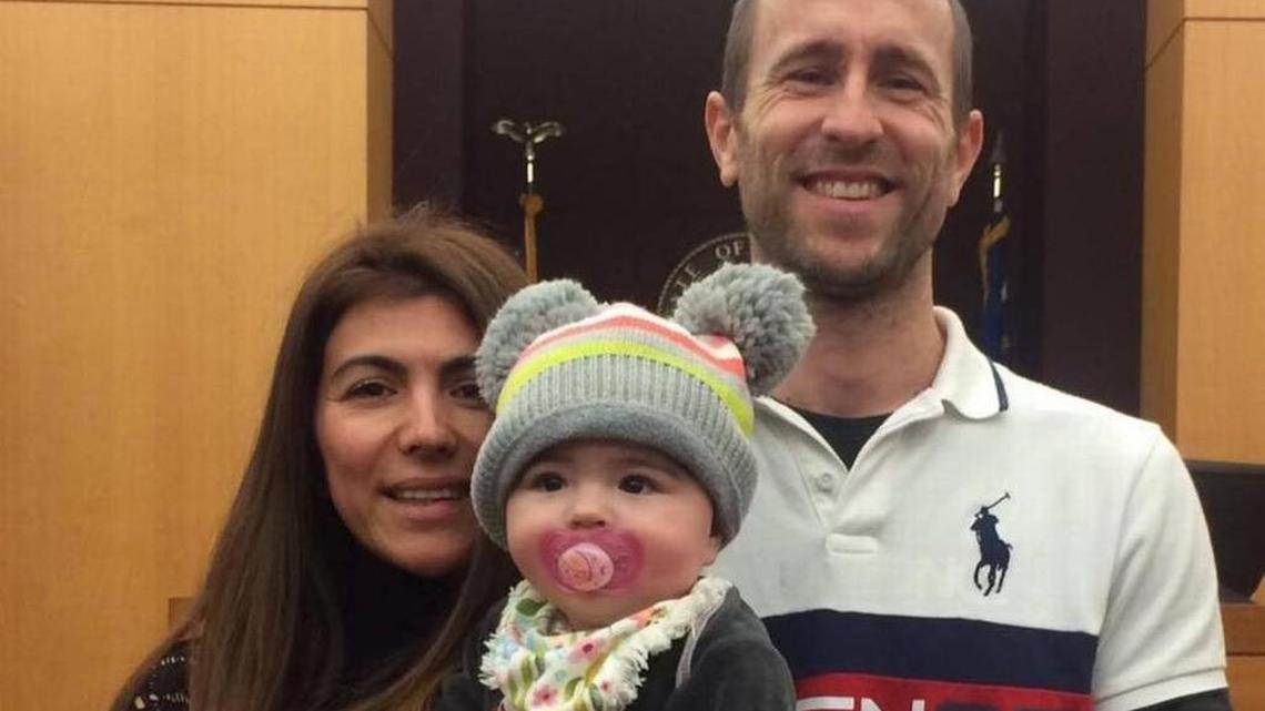 Lewis Bennett, right, was charged Tuesday with killing his wife, Isabella Hellmann (shown here with their son) and intentionally trying to sink the vessel to cover his tracks.