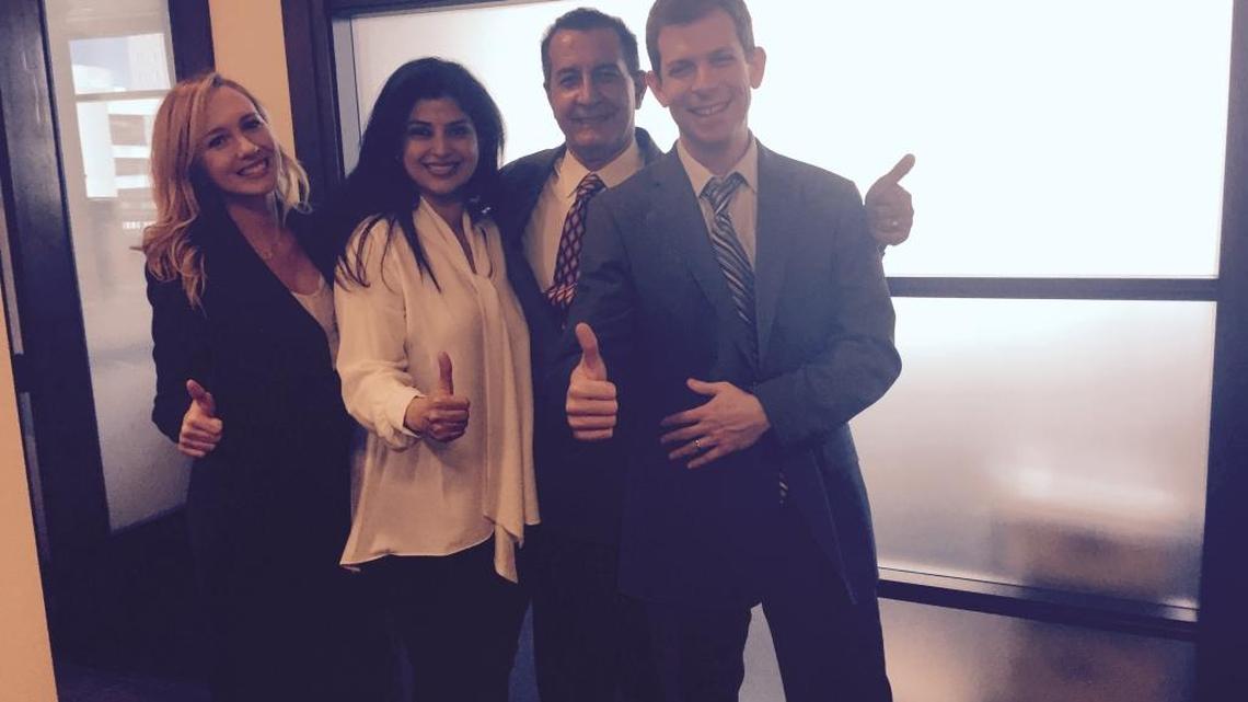 Dr. Michael Bahrami, second from right, celebrates with his wife, Mahsa, and his defense attorneys, Lauren Doyle and David O. Markus, after the cardiologist was acquitted Wednesday of receiving kickbacks for patient referrals to home healthcare agencies that bilked the Medicare program.