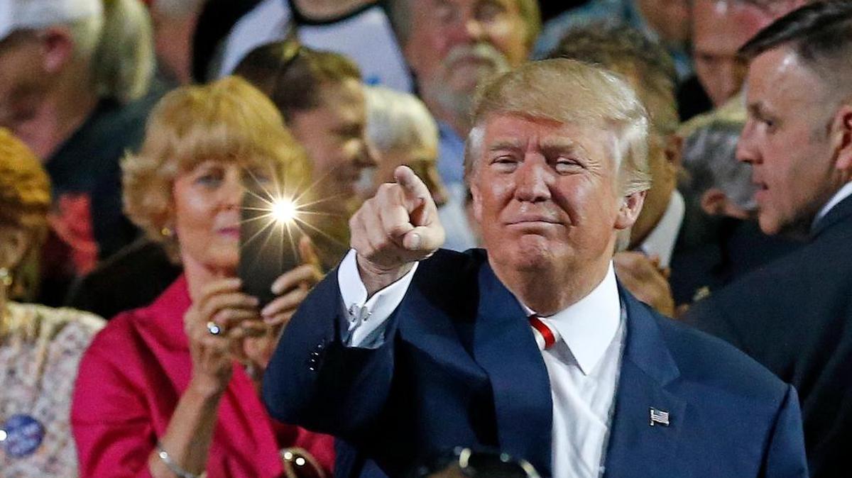 Republican presidential candidate Donald Trump points to supporters after speaking at a campaign rally Tuesday, Oct. 4, 2016, in Prescott Valley, Ariz.