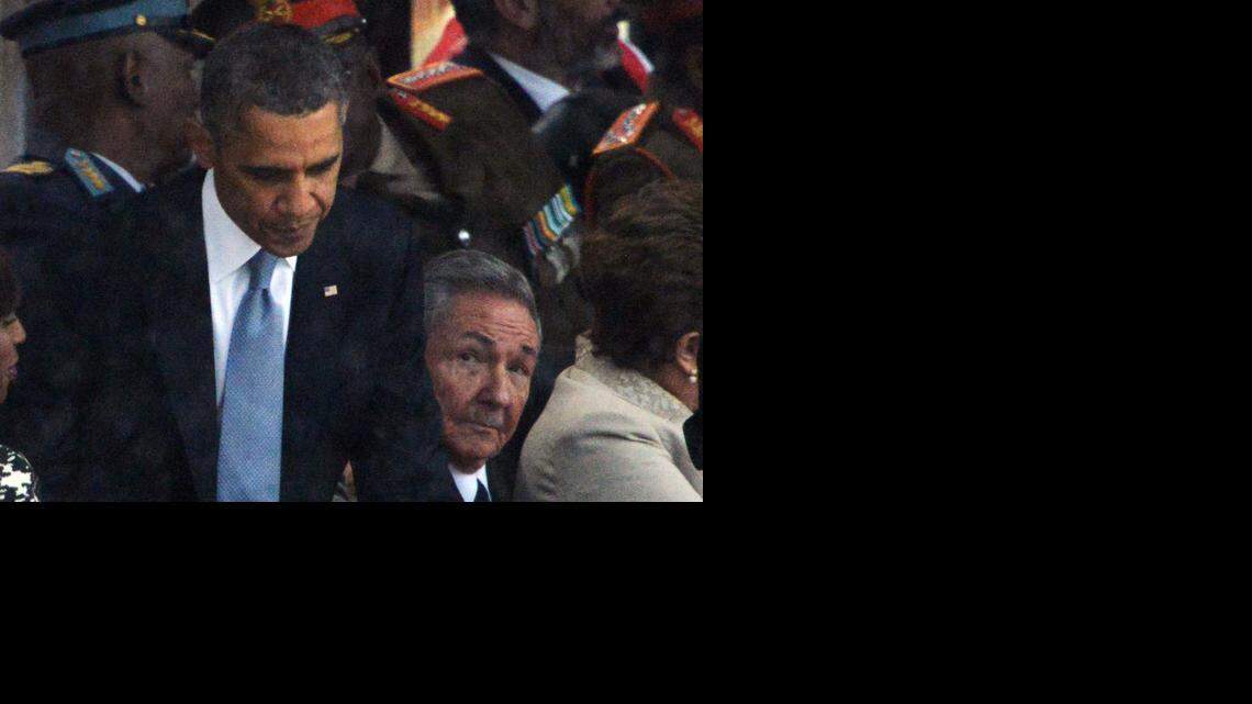 
A NEW DAY: Cuban leader Raúl Castro Ruz (R) looks at President Barack Obama (L) after his address during the memorial service of South African former president Nelson Mandela. Cuba and the U.S. last week announced plans to normalize relations. 
