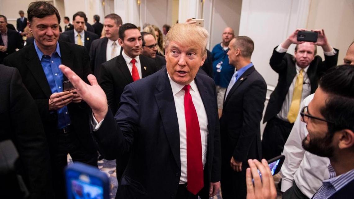 Donald Trump talks with reporters at the Trump National Golf Club in Jupiter, Florida. The GOP candidate galvanized white working-class voters in both Michigan and Mississippi.