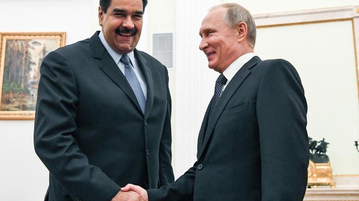 Russian President Vladimir Putin, right, shakes hands with Venezuela's President Nicolas Maduro during their meeting at the Kremlin in Moscow, Russia, Wednesday, Oct. 4, 2017.