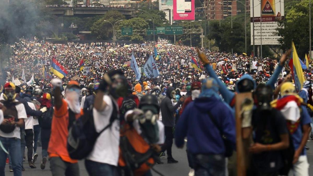 Thousands of opponents of President Nicolás Maduro march in Caracas, Venezuela, Wednesday, April 26, 2017. Security forces blocked anti-government protesters that attempted to march downtown in another day of protests that have already claimed dozens of lives since the start of April.