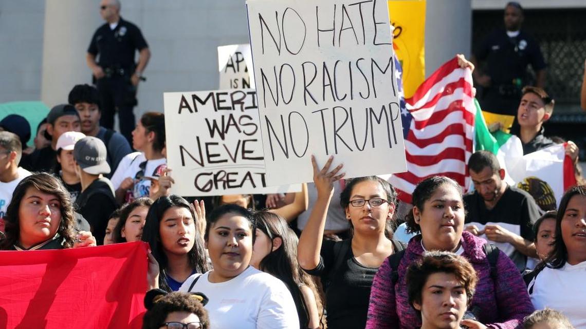 Students from several high schools rally after walking out of classes to protest the election of Donald Trump as president in downtown Los Angeles.
