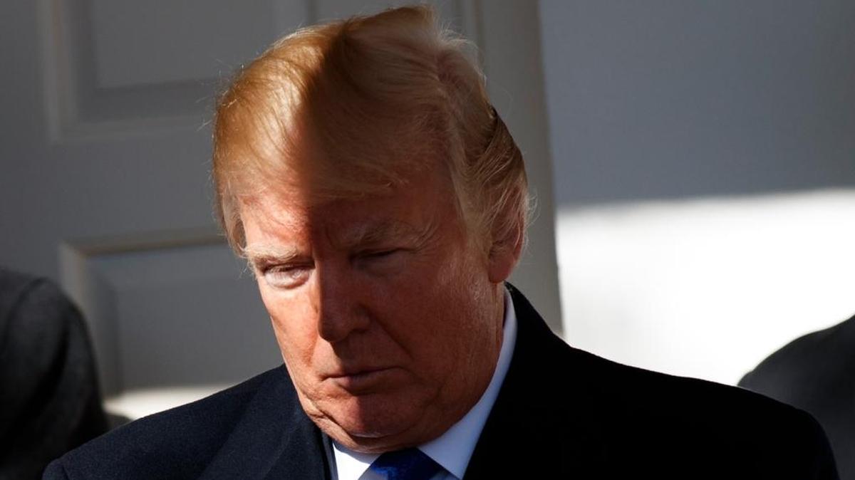 President Donald Trump waits to be introduced to speak to the March for Life participants from the Rose Garden of the White House, Friday, Jan. 19, 2018, in Washington.
