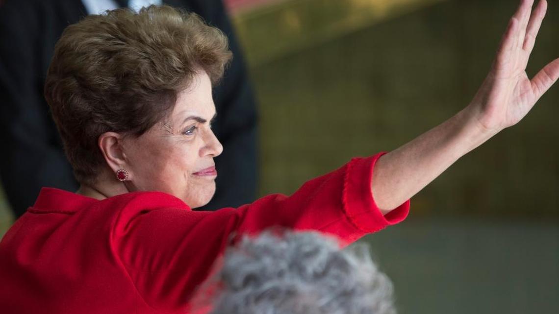 Brazil's suspended President Dilma Rousseff waves to supporters before speaking from the official residence of the president, Alvorada Palace in Brasilia, Brazil, Wednesday, Aug. 31, 2016.