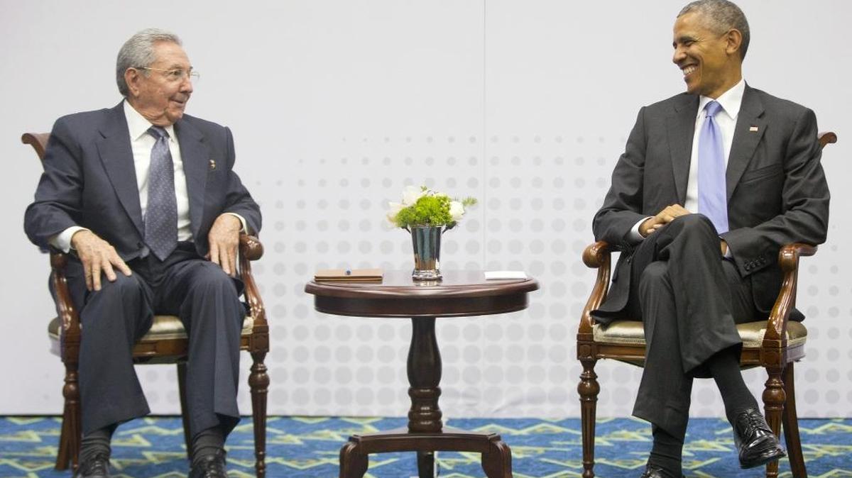 U.S. President Barack Obama will travel to Cuba in March. In this Saturday, April 11, 2015 photo, Obama, right, smiles as he looks over towards Cuban President Raul Castro, left, during their historic meeting, at the Summit of the Americas in Panama City, Panama. The leaders of the United States and Cuba held their first formal meeting in more than half a century.