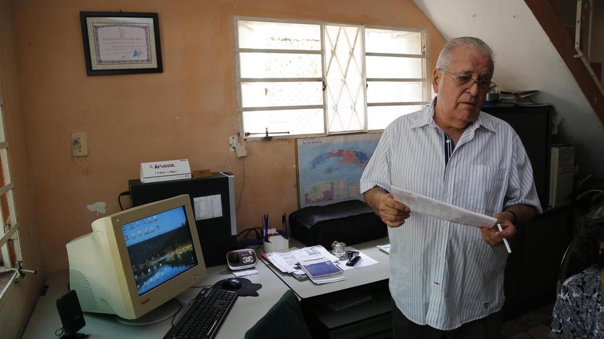 In this July 2, 2015 photo, dissident Elizardo Sánchez, president of the Cuban Commission for Human Rights and National Reconciliation, stands in his home in Havana, Cuba. He is scheduled to attend a private meeting between U.S. President Barack Obama and a small group of Cuban dissidents in Havana on Tuesday. Sanchez has no illusions that Obama’s trip will bring about any important changes on the island.