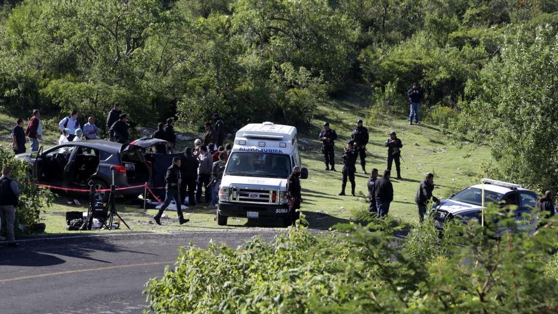 Police secure the site where the Mayor of Huehuetlan, Jose Sanataria Zavala, was found dead in Puebla State, Mexico, Tuesday, Aug. 2, 2016. Santamaria Zavala, the fifth Mexican mayor to be killed this year, was found dead beside his SUV on the side of a rural highway according to a statement of the Puebla state Attorney General's office.