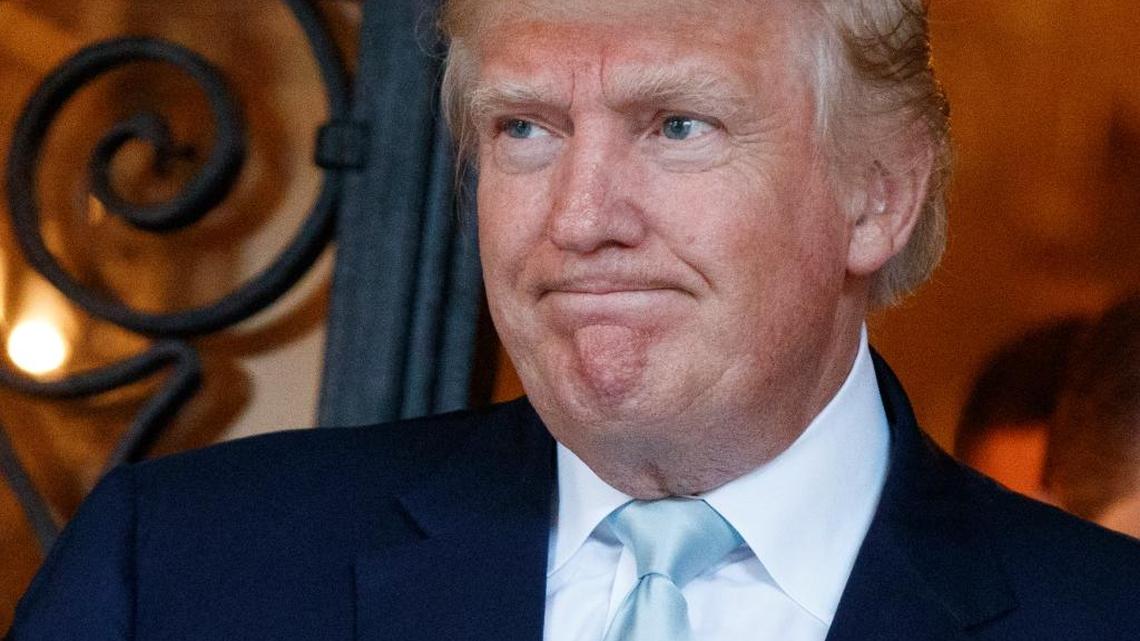 In this Dec. 28, 2016, photo, President-elect Donald Trump talks to reporters at Mar-a-Lago in Palm Beach.