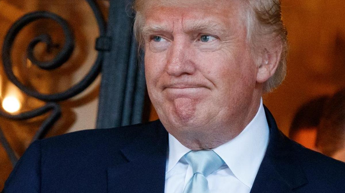 In this Dec. 28, 2016, photo, President-elect Donald Trump talks to reporters at Mar-a-Lago in Palm Beach.
