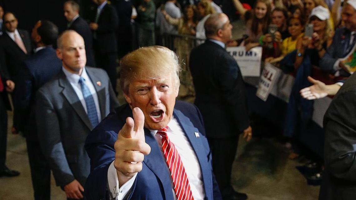 Republican presidential candidate Donald Trump acknowledges photographers after speaking at a campaign rally in Baton Rouge, La., Thursday, Feb. 11, 2016.