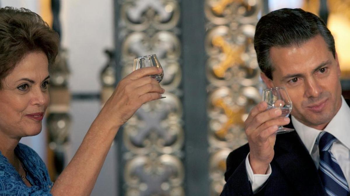 Mexico's President Enrique Pena Nieto, right, and President Dilma Rousseff of Brazil share a toast during an official ceremony at the National Palace in Mexico City in May. Both leaders have helped to drive major increases in the number of students from Brazil and Mexico studying in the United States.