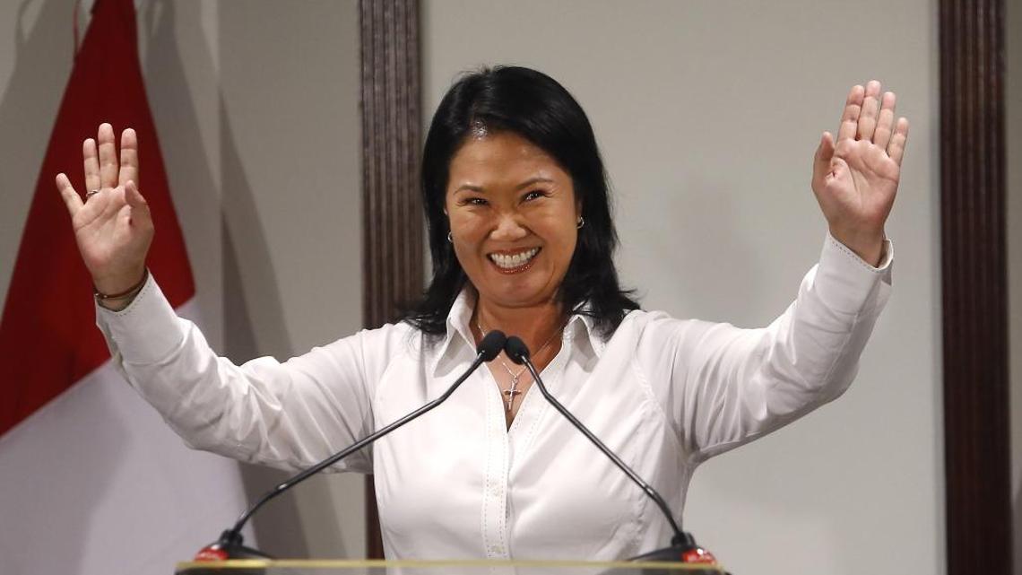 Peru presidential candidate Keiko Fujimori waves to the press in Lima, Peru on Sunday. The right-leaning daughter of jailed former president Alberto Fujimori topped Peru's presidential election but with less than the 50 percent required for victory.