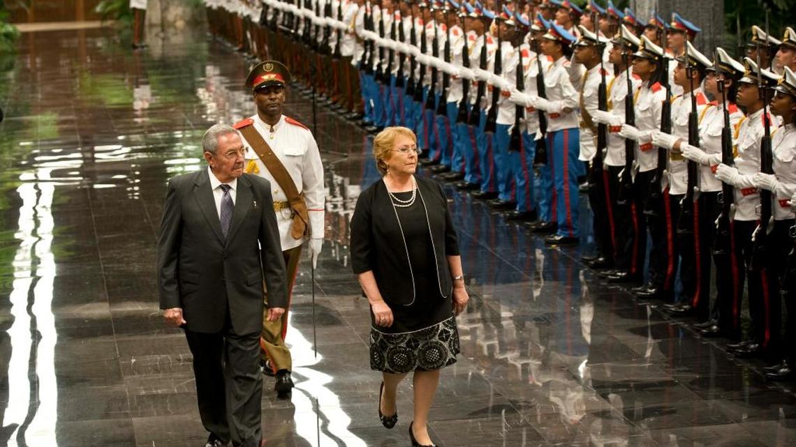 Chile’s President Michelle Bachelet, right, and Cuba’s President Raúl Castro review an honor guard at Revolution Palace in Havana on Jan. 8. Bachelet is on a two-day visit.